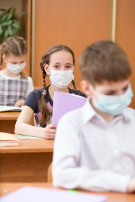 students wearing mouth mask against virus in class room in school students wearing mouth mask against virus in class room in school